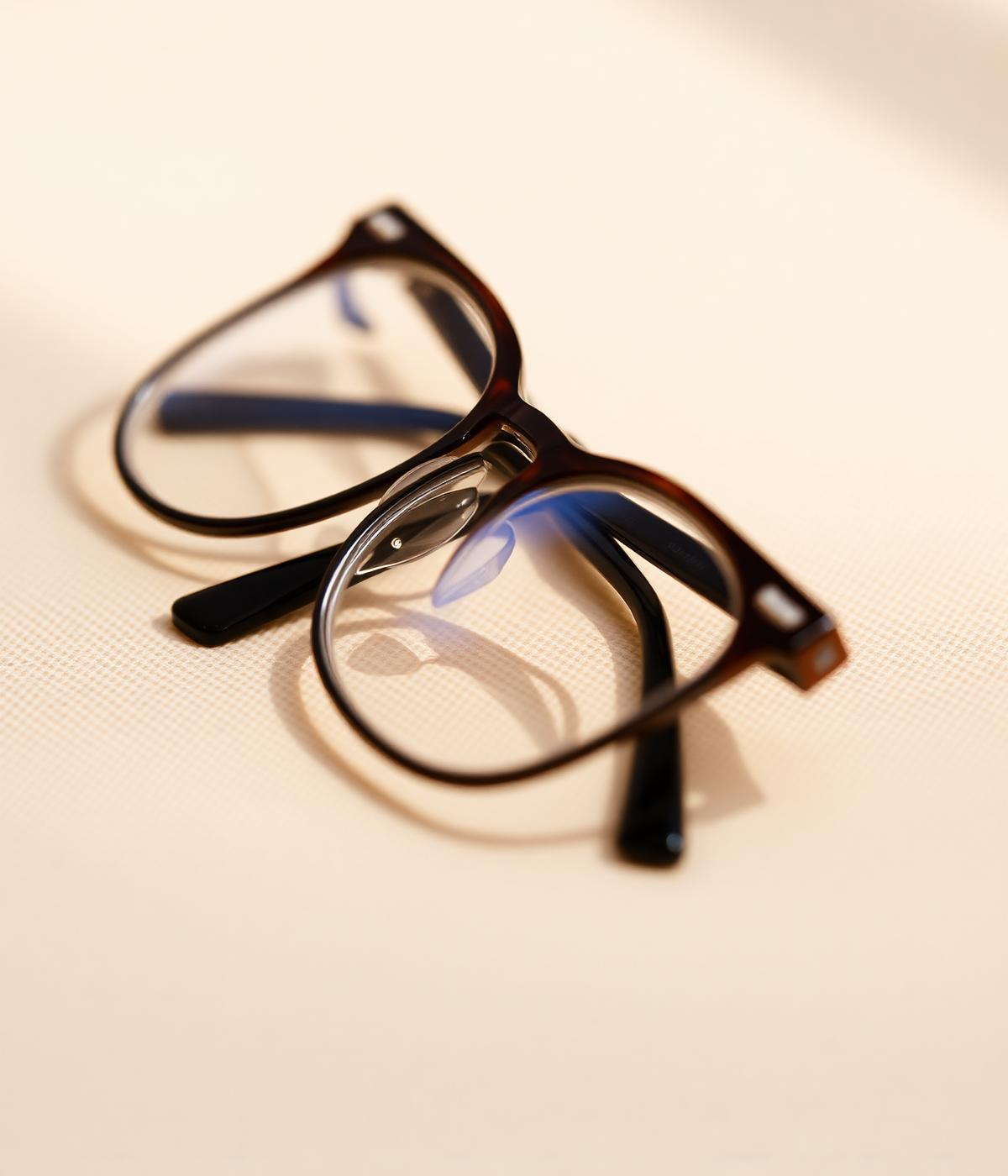 Modern eyeglasses on a linen surface